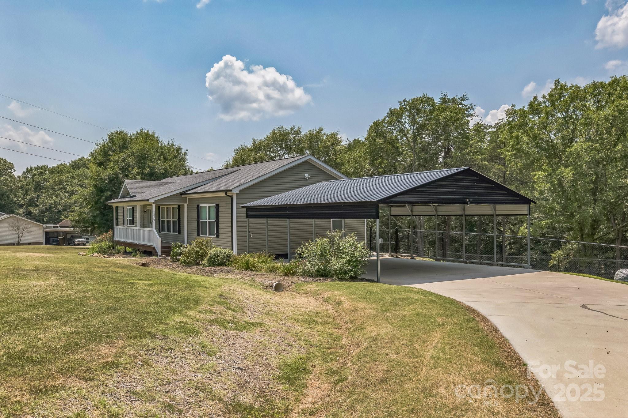 1259 Hardin Road Dallas, NC 28034 - Photo 2 of 16 a front view of a house with a yard