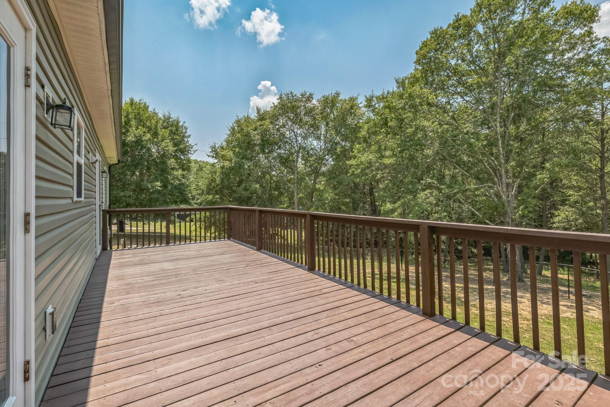 1259 Hardin Road Dallas, NC 28034 - Photo 3 of 16 a balcony with wooden floor and fence