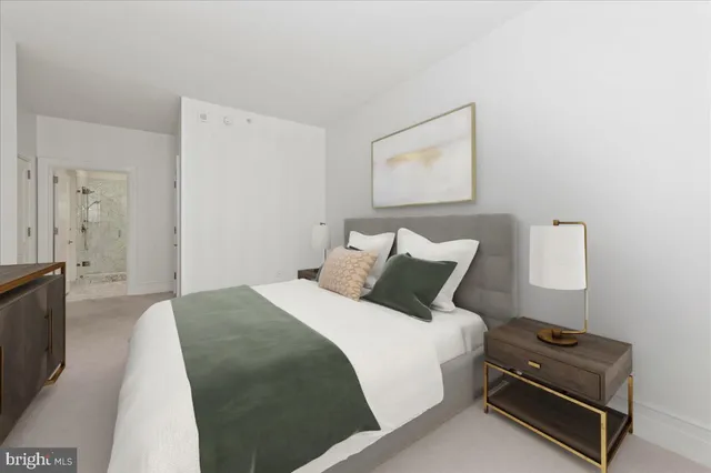 a bedroom with a bed and a couch