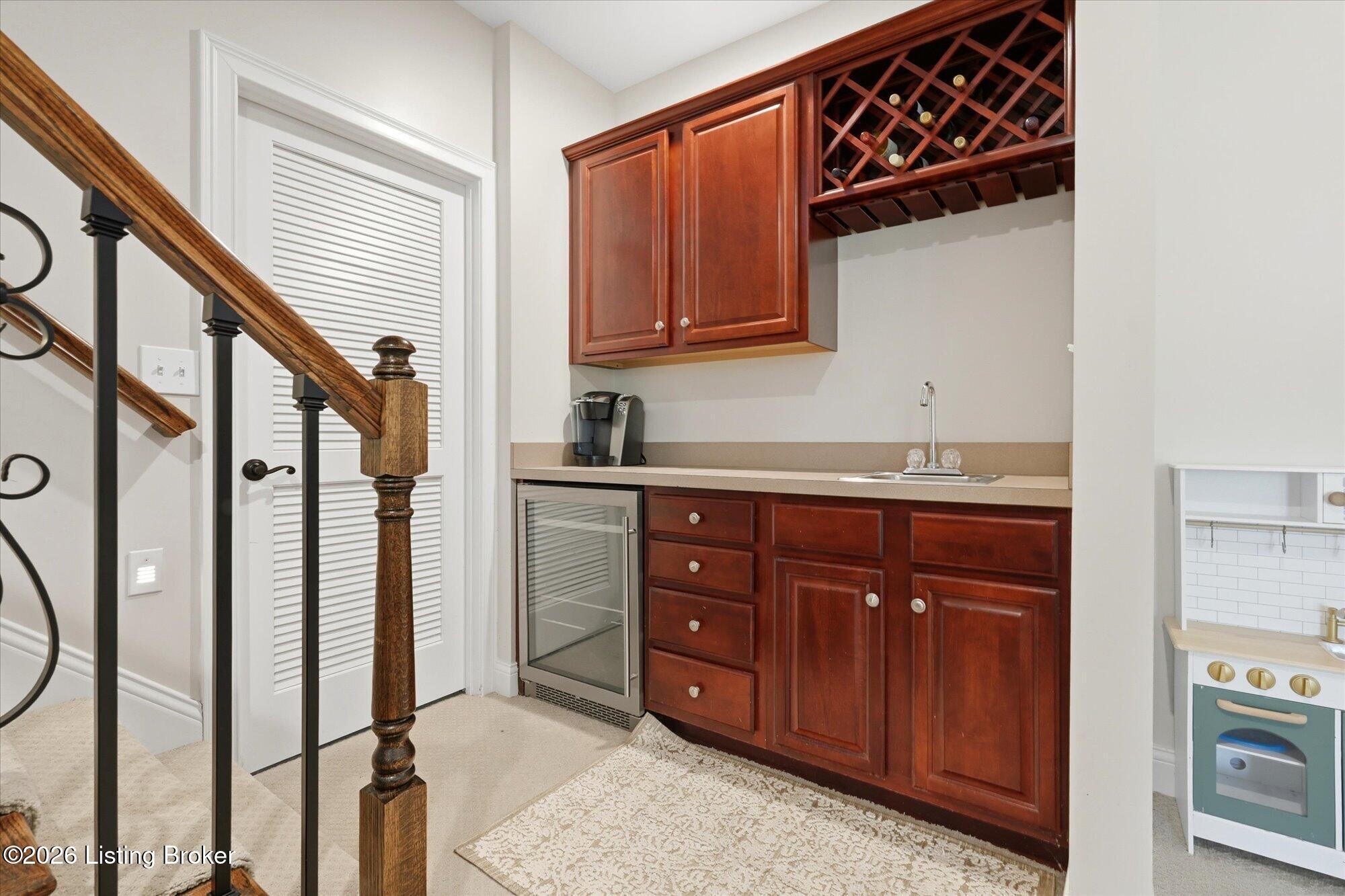 5722 Moser Farm Road Prospect, KY 40059 - Photo 42 of 65 An inviting lower level designed for entertaining, complete with a wet bar that opens into a versatile flex space.