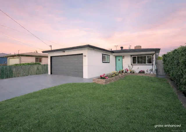 a front view of house with yard and outdoor seating