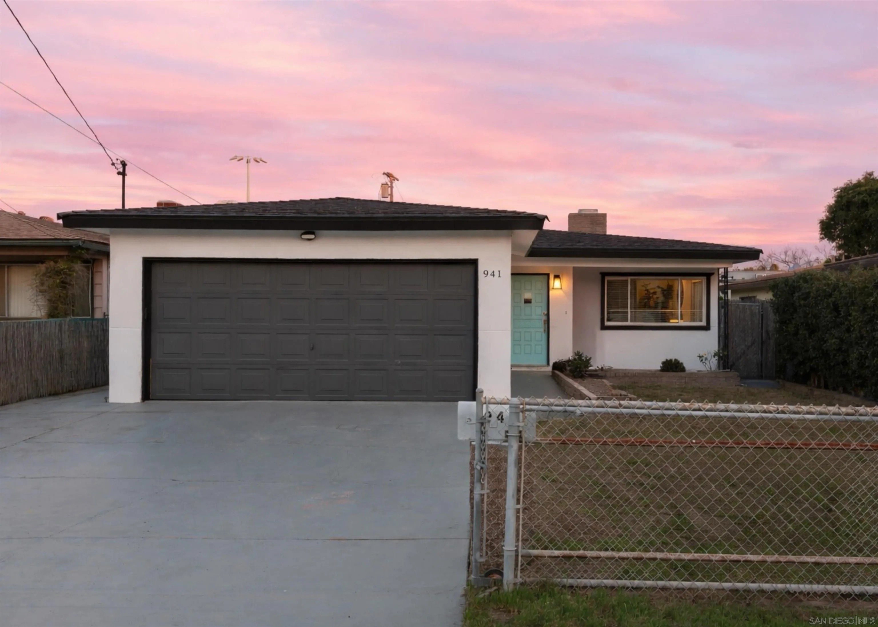 941 8th Street Imperial Beach, CA 91932 - Photo 21 of 22 a front view of a house with a garage