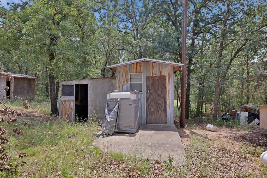 318 Bavarian Road Waco, TX 76705 - Photo 24 of 26 a front view of house with yard and trees