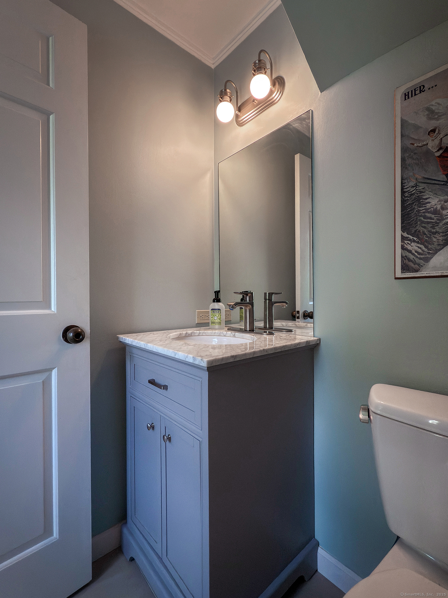87 Canaan Road, Unit 2G Salisbury, CT 06068 - Photo 16 of 30 a bathroom with a toilet sink and mirror