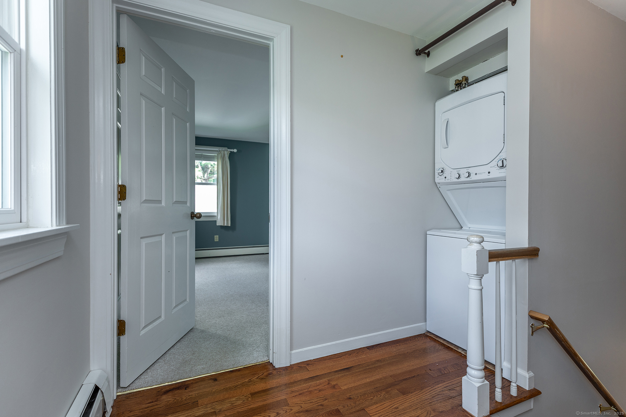 87 Canaan Road, Unit 2G Salisbury, CT 06068 - Photo 17 of 30 a view of a hallway with wooden floor