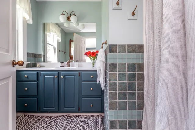 a view of a livingroom with workspace and a window