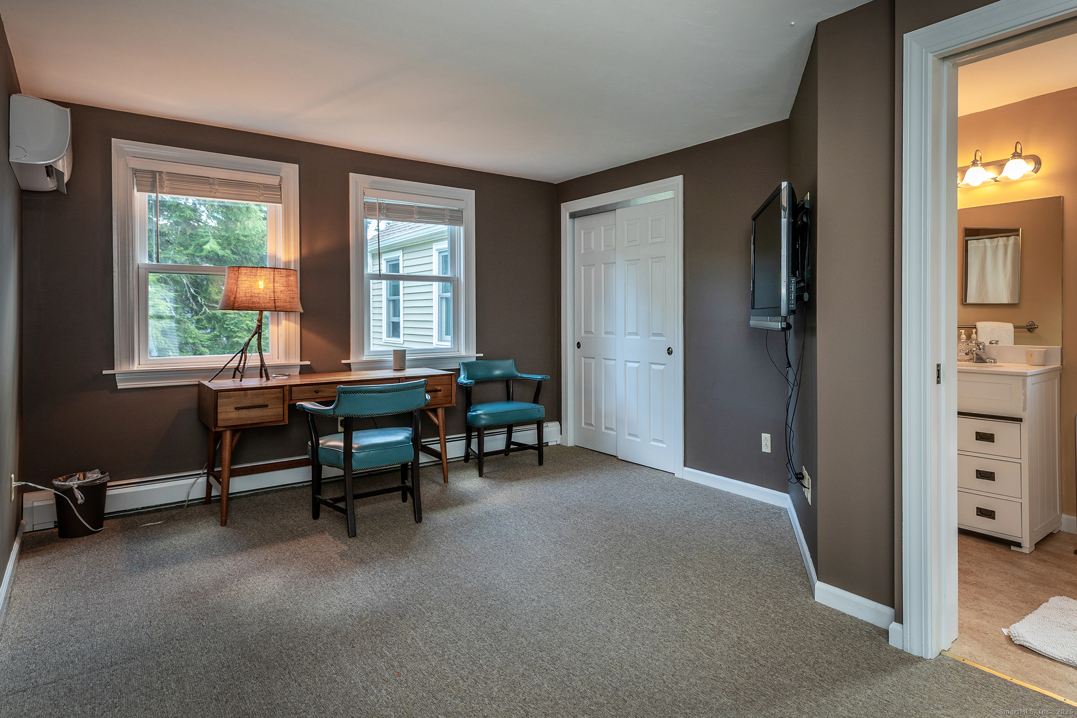 87 Canaan Road, Unit 2G Salisbury, CT 06068 - Photo 20 of 30 a view of a livingroom with workspace and a window