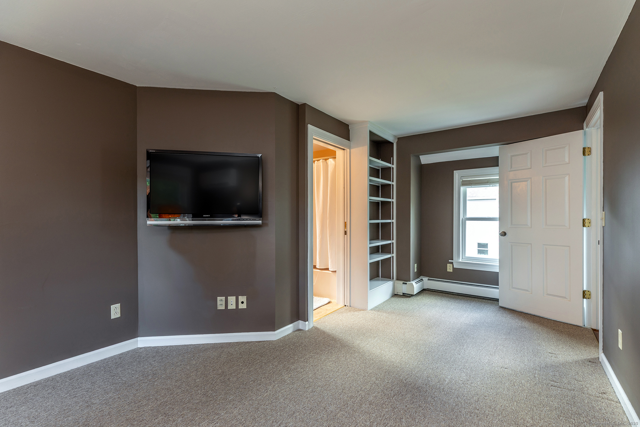 87 Canaan Road, Unit 2G Salisbury, CT 06068 - Photo 21 of 30 a view of a livingroom with a flat screen tv