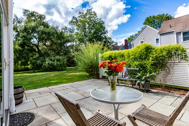 a view of a house with a yard and plants