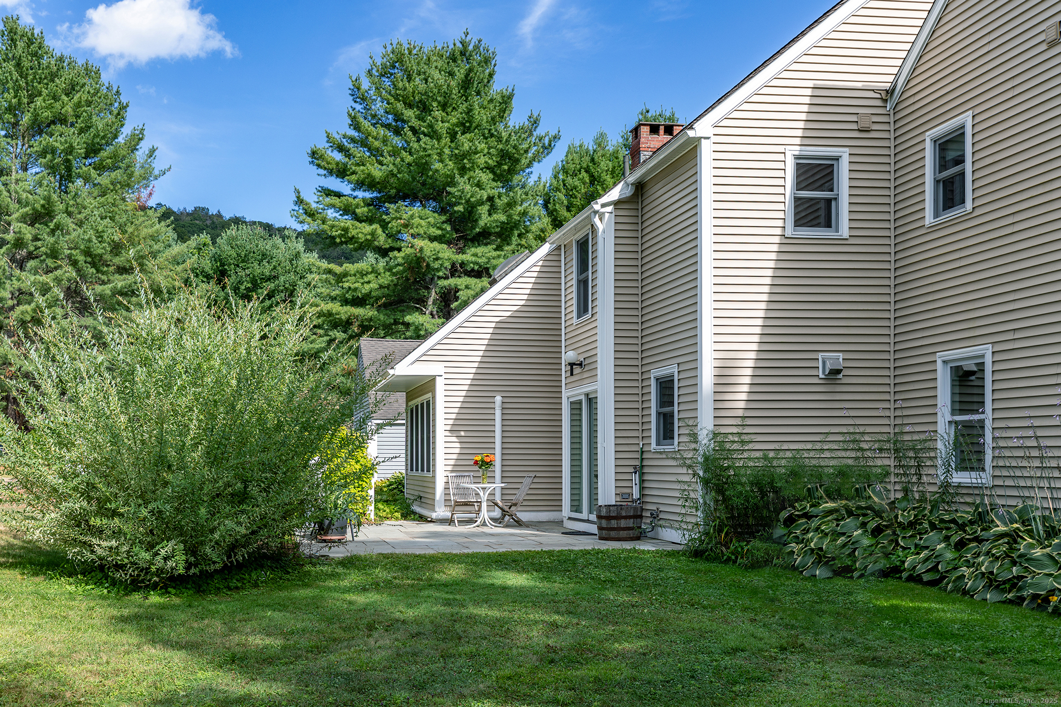 87 Canaan Road, Unit 2G Salisbury, CT 06068 - Photo 28 of 30 a view of a house with a yard and plants