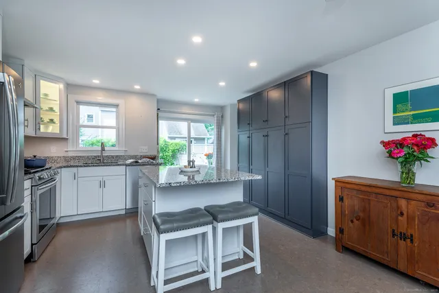 a kitchen with sink cabinets and window