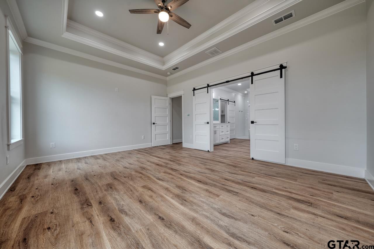 19383 Ridge Point Circle Lindale, TX 75771 - Photo 24 of 48 a view of an empty room and wooden floor