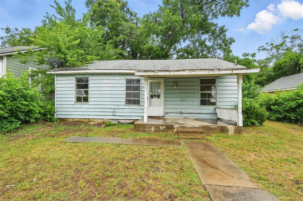a view of a house with pool and a tree in the background
