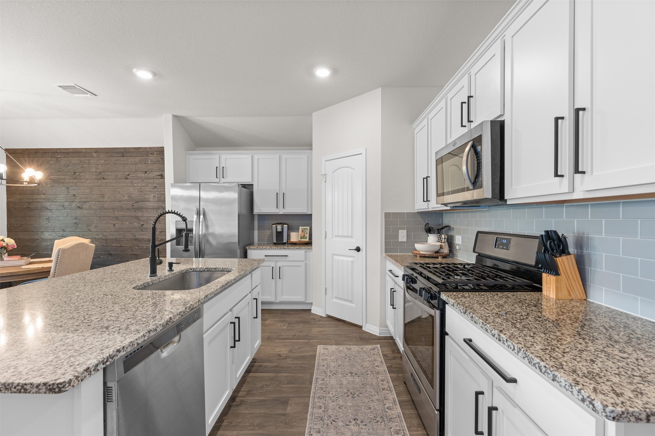19912 Abigail Fillmore Road Manor, TX 78653 - Photo 5 of 31 Culinary delights await in this bright kitchen, complete with ample counter space and modern appliances.