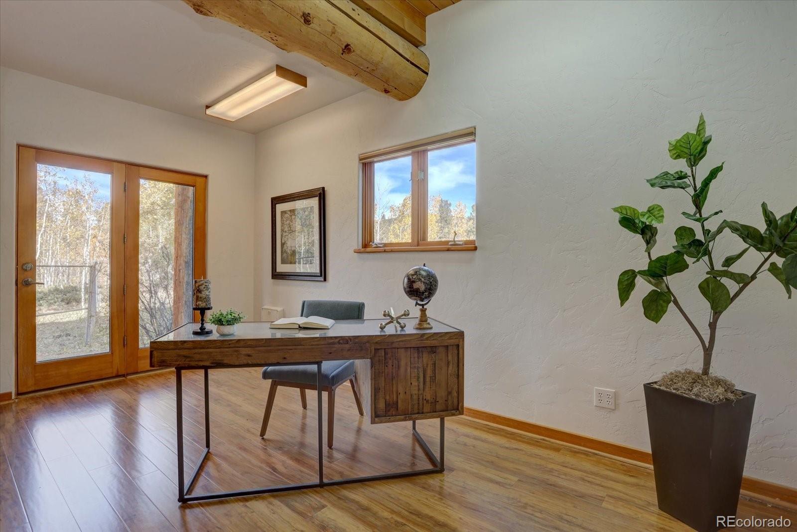 12227 Calfee Gulch Road Conifer, CO 80433 - Photo 18 of 43 a dining room with furniture and window