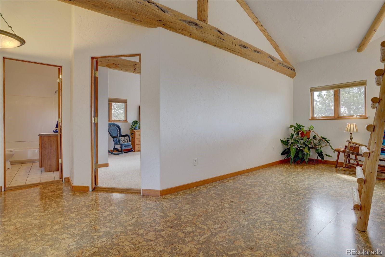 12227 Calfee Gulch Road Conifer, CO 80433 - Photo 21 of 43 a view of a livingroom with a garage