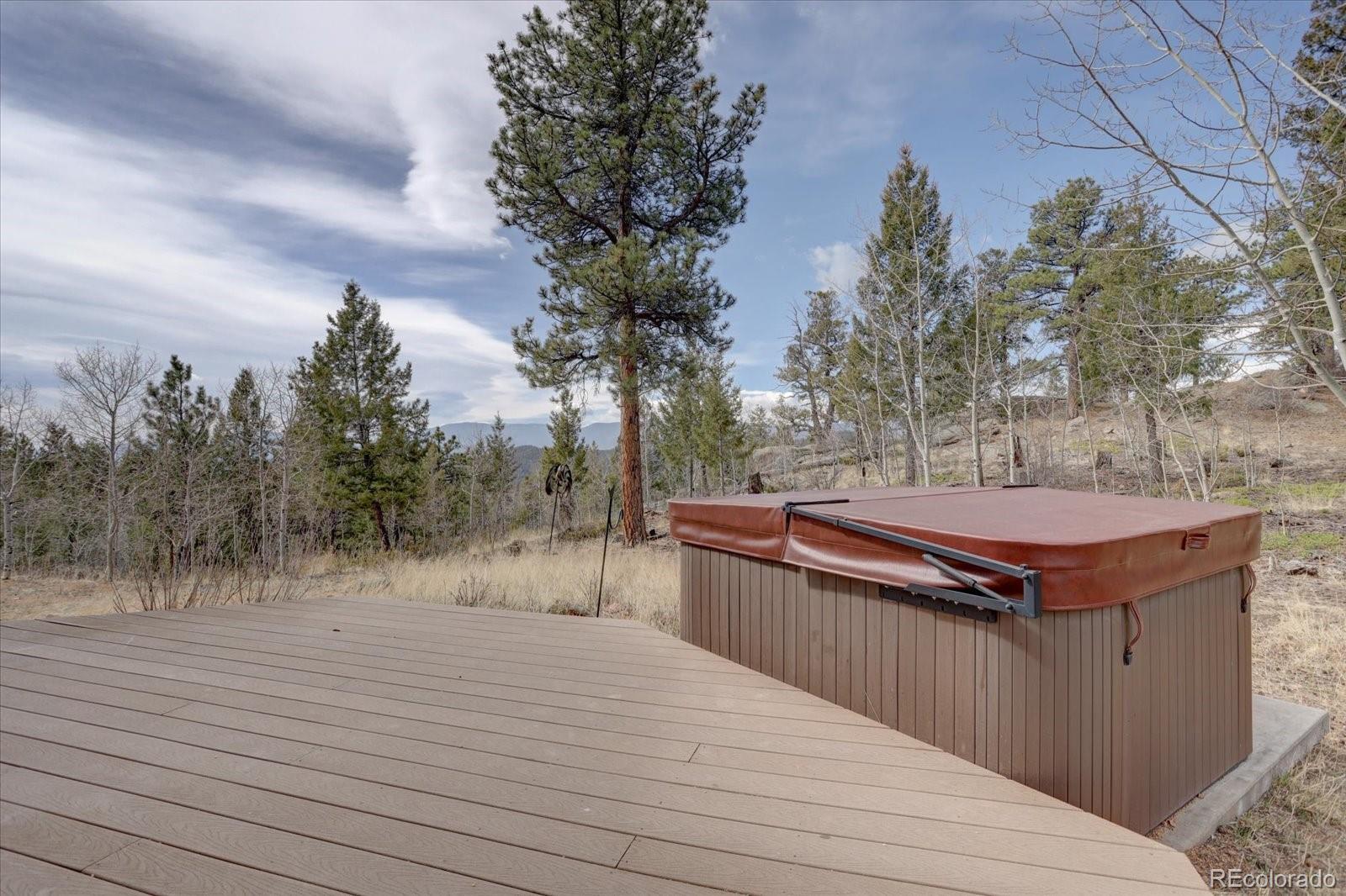12227 Calfee Gulch Road Conifer, CO 80433 - Photo 35 of 43 a view of a backyard with wooden fence