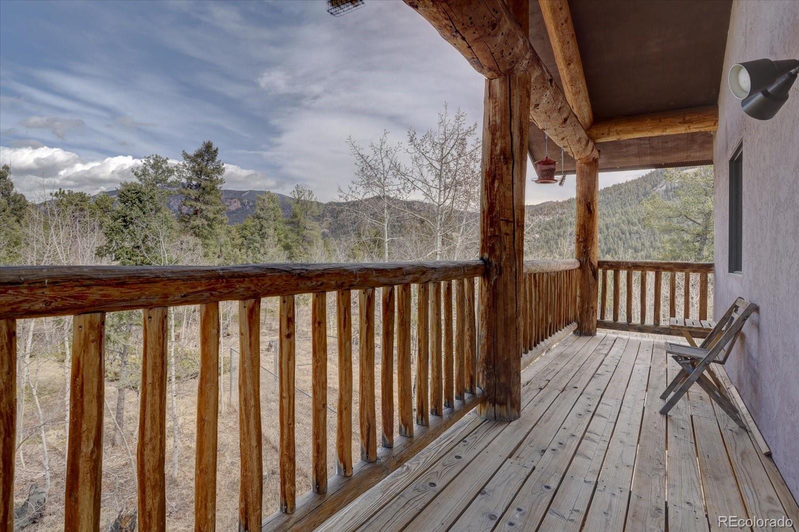 12227 Calfee Gulch Road Conifer, CO 80433 - Photo 36 of 43 a view of a balcony with wooden floor