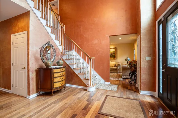 a view of an entryway with wooden floor