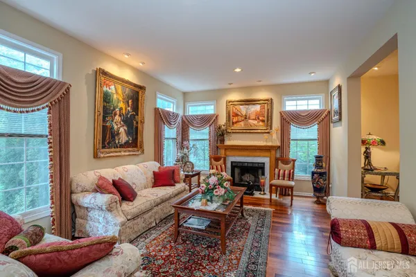 a kitchen with stainless steel appliances granite countertop a stove top oven a refrigerator a sink and dishwasher