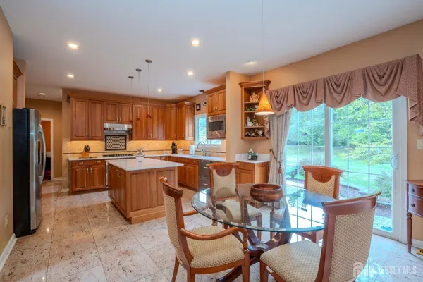 a kitchen with a sink stove and refrigerator