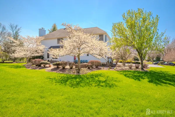 a front view of a house with a big yard