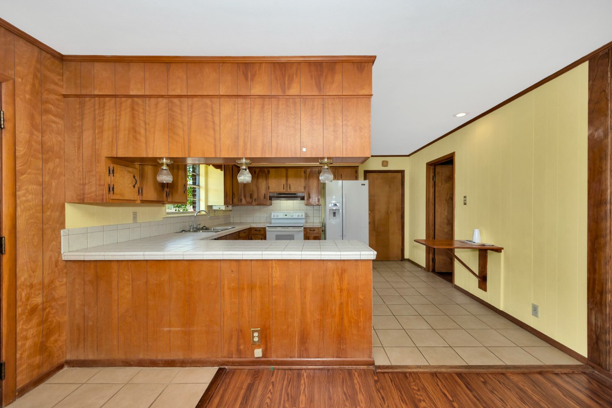 40 Blanche Road Taft, TN 38488 - Photo 11 of 38 a kitchen with stainless steel appliances granite countertop a sink and cabinets