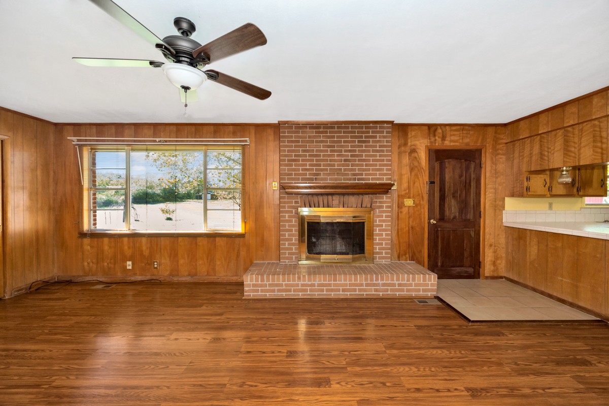 40 Blanche Road Taft, TN 38488 - Photo 13 of 38 a view of a livingroom with a fireplace a ceiling fan and front door