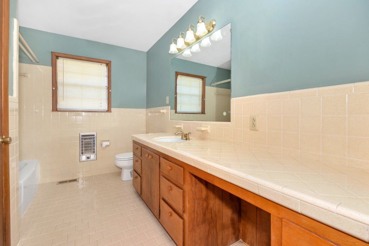 40 Blanche Road Taft, TN 38488 - Photo 21 of 38 a bathroom with a sink a toilet and mirror