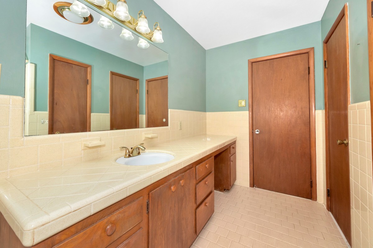 40 Blanche Road Taft, TN 38488 - Photo 22 of 38 a bathroom with a sink a vanity and a mirror