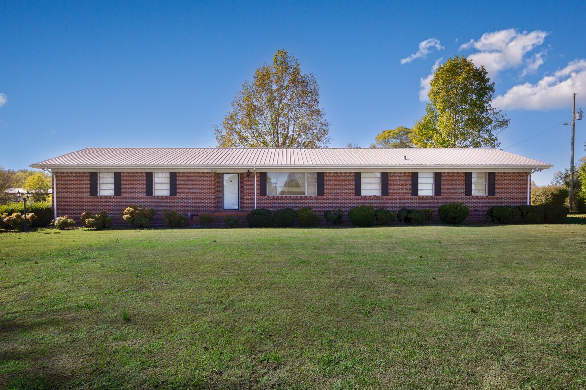 40 Blanche Road Taft, TN 38488 - Photo 24 of 38 a view of a big yard with table and chairs and potted plants