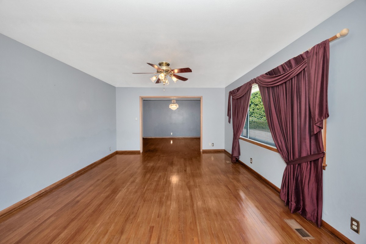 40 Blanche Road Taft, TN 38488 - Photo 5 of 38 a view of an empty room with wooden floor and a window