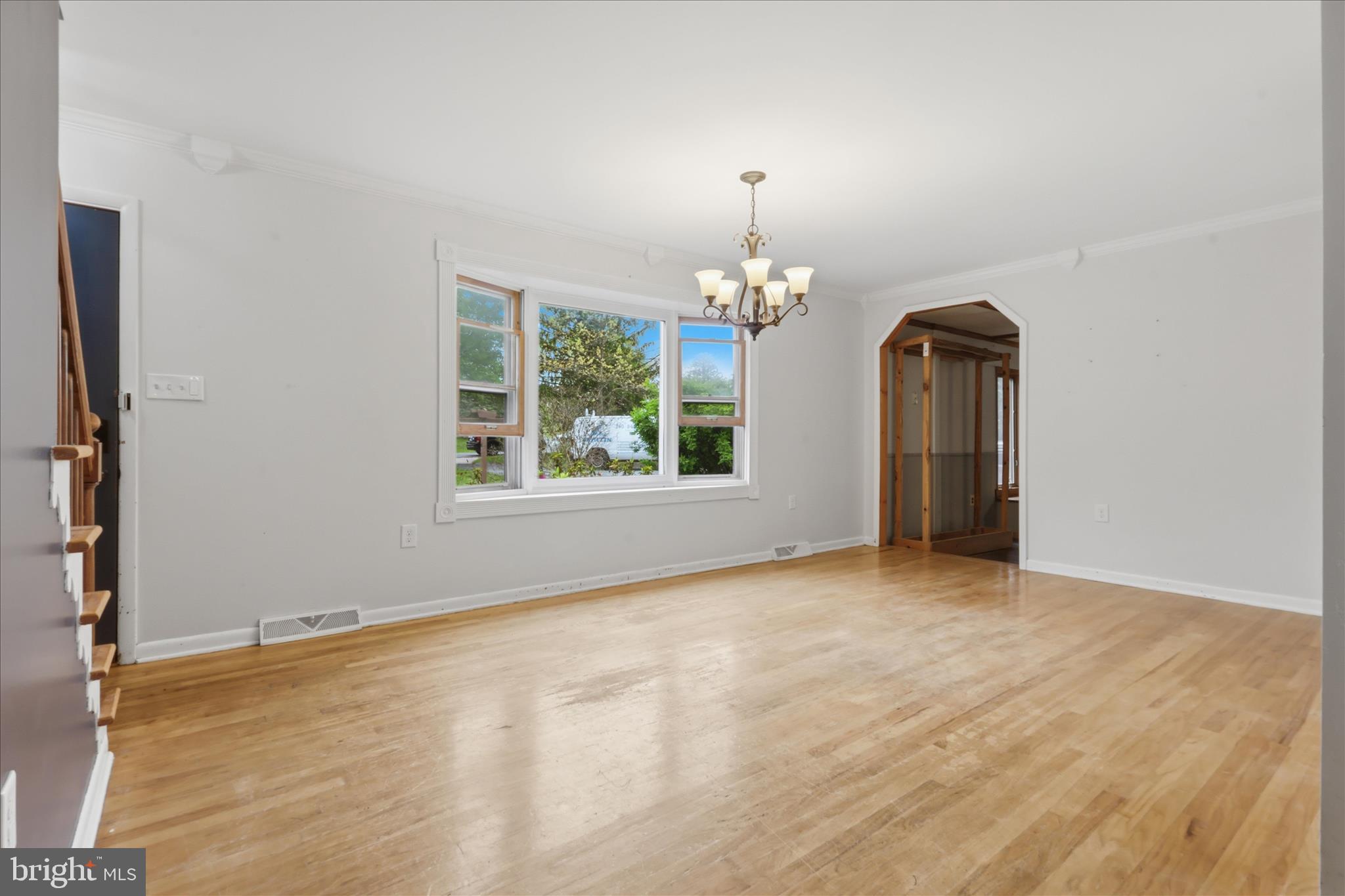 9304 Liberty Court Frederick, MD 21701 - Photo 14 of 49 an empty room with chandelier fan and windows