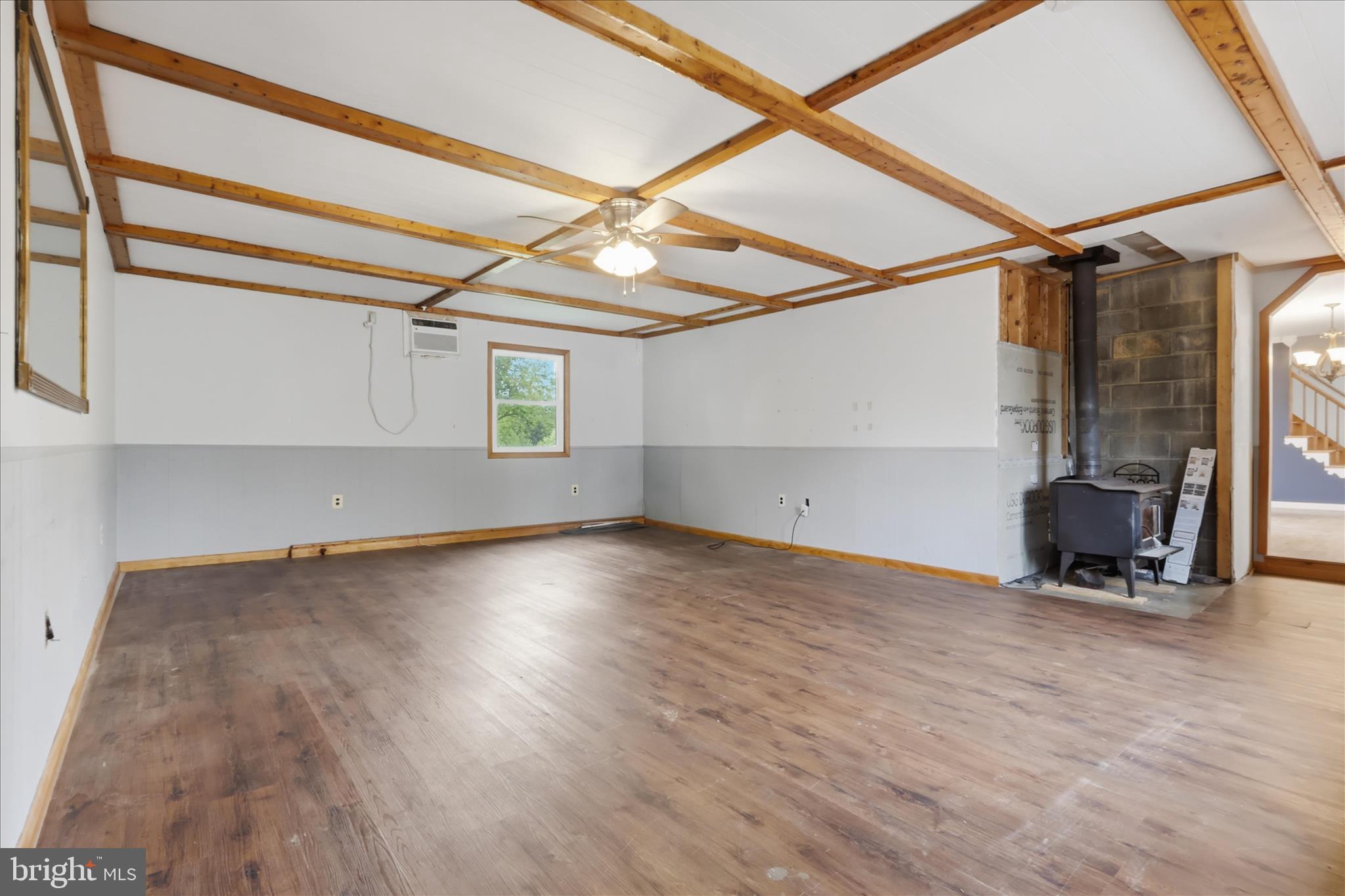 9304 Liberty Court Frederick, MD 21701 - Photo 17 of 49 a view of empty room with wooden floor and fan
