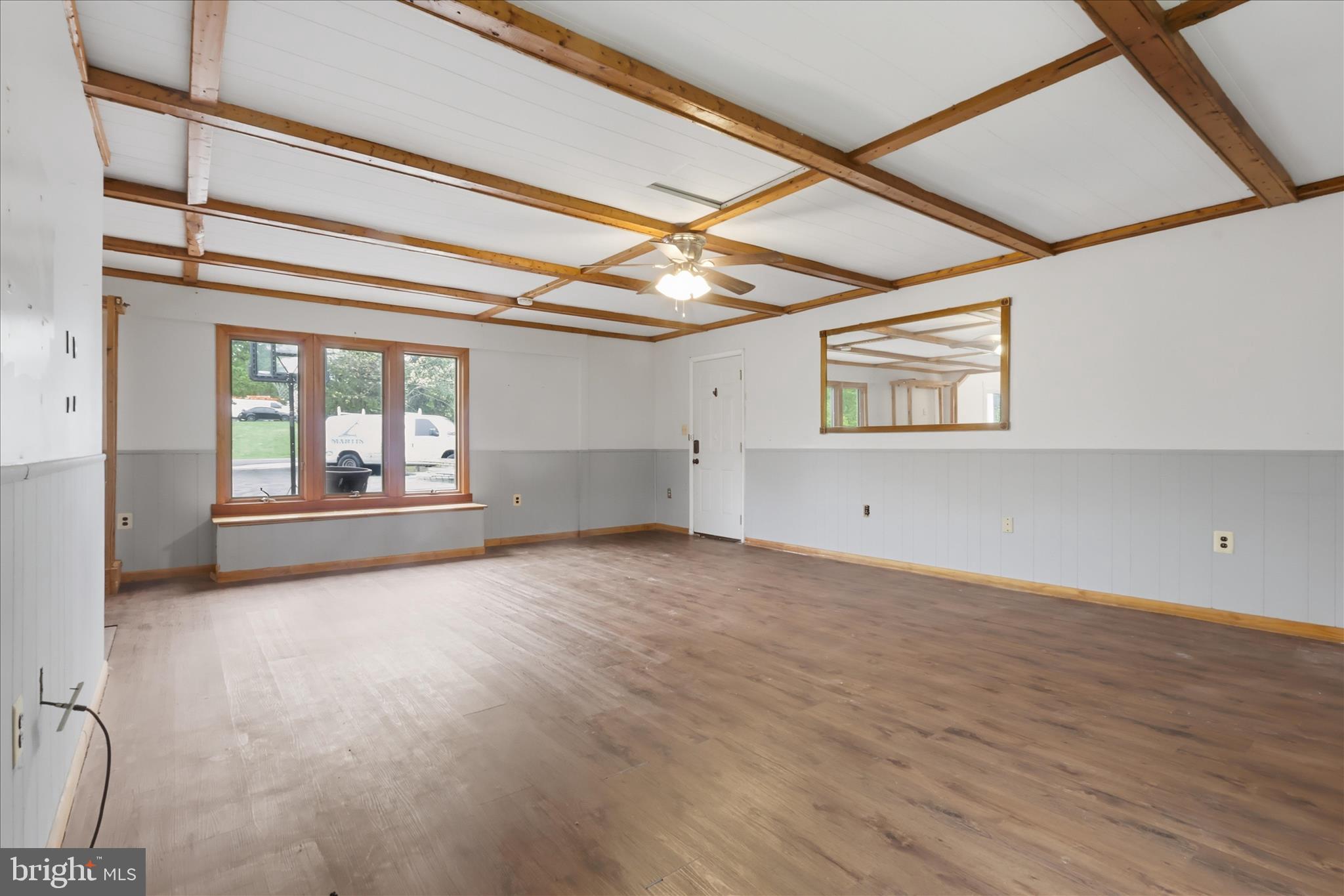 9304 Liberty Court Frederick, MD 21701 - Photo 18 of 49 an empty room with wooden floor and windows