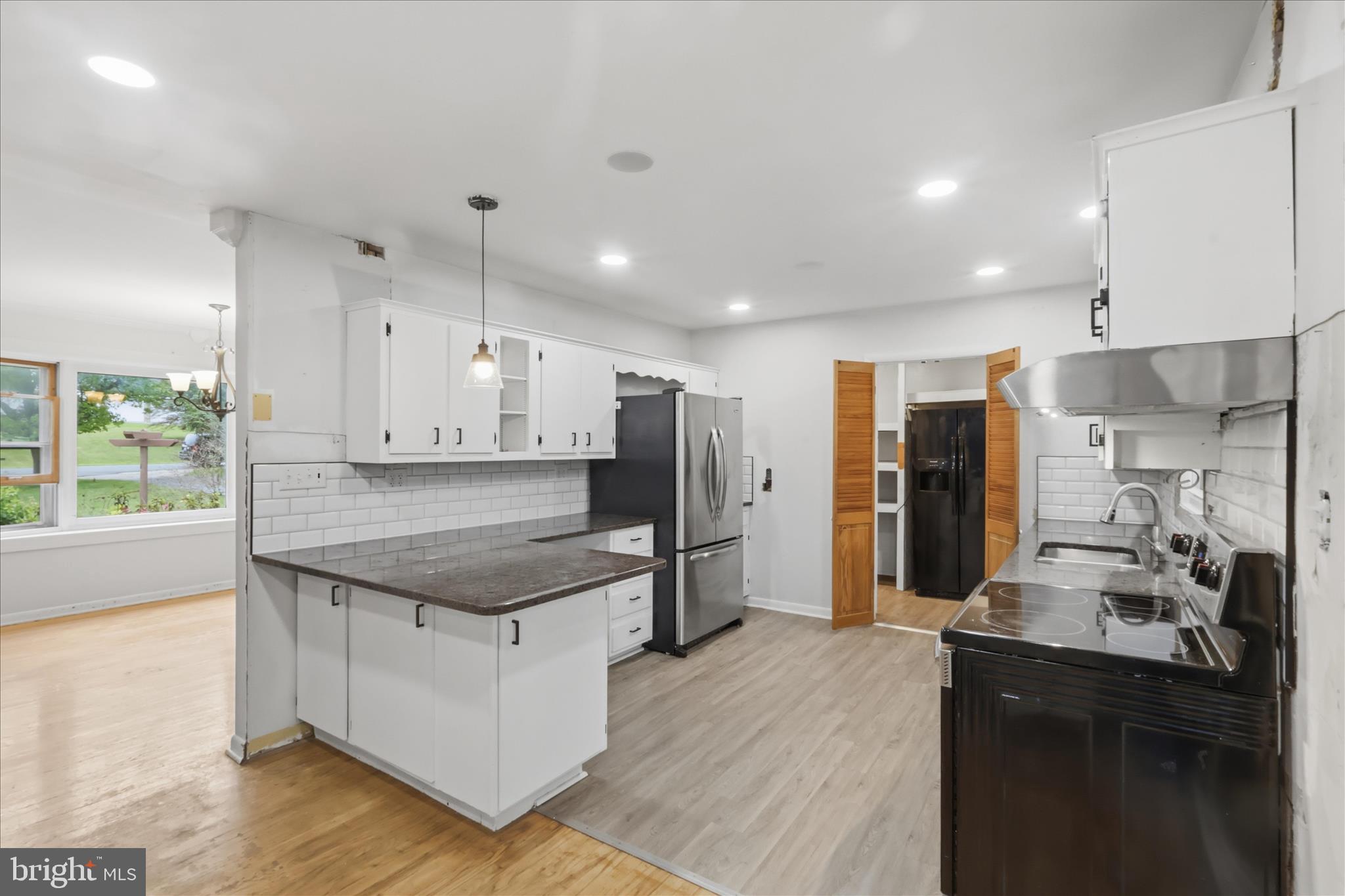 9304 Liberty Court Frederick, MD 21701 - Photo 20 of 49 a kitchen with stainless steel appliances granite countertop a sink refrigerator and cabinets