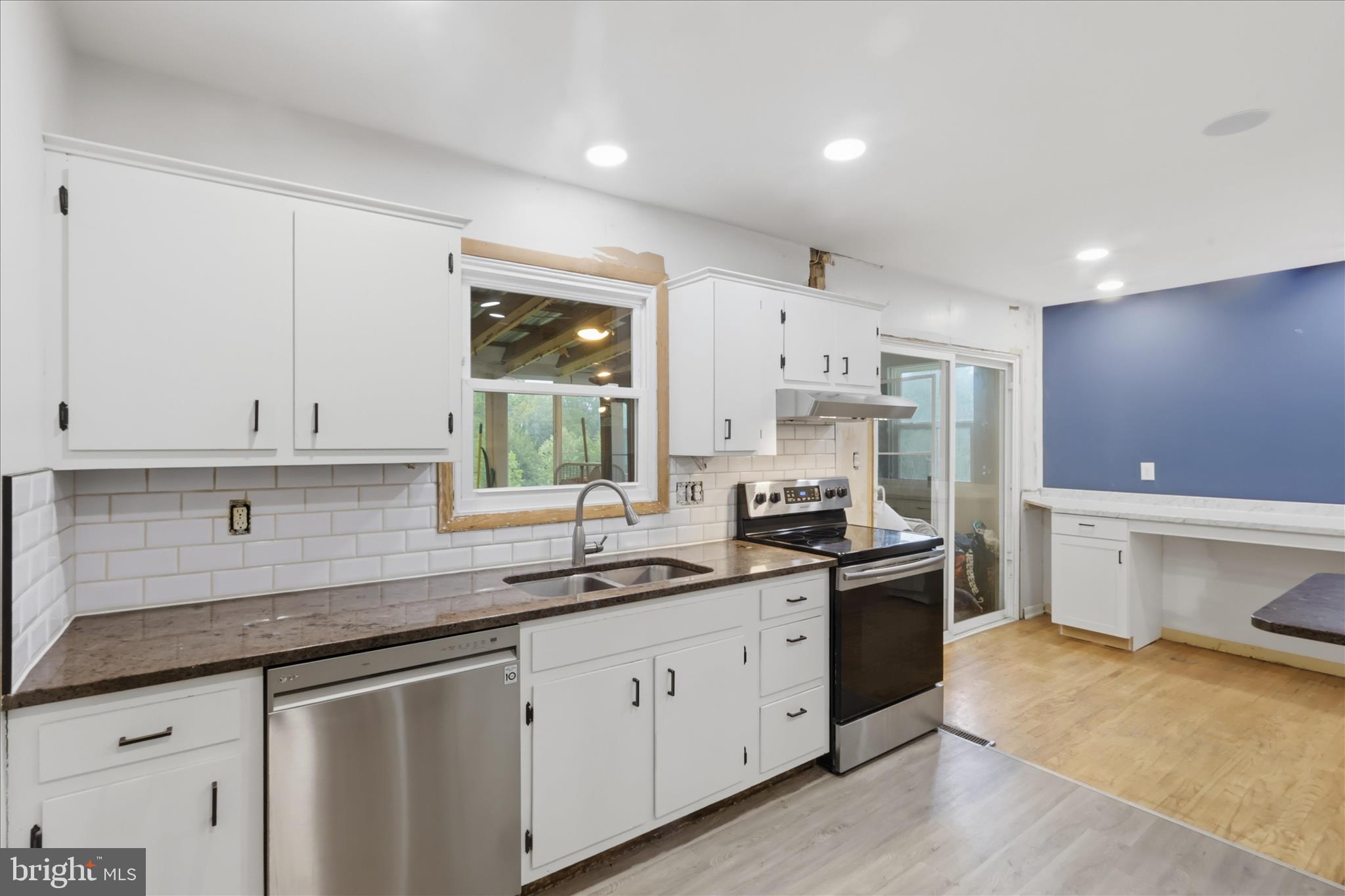 9304 Liberty Court Frederick, MD 21701 - Photo 21 of 49 a kitchen that has a sink and a stove in it