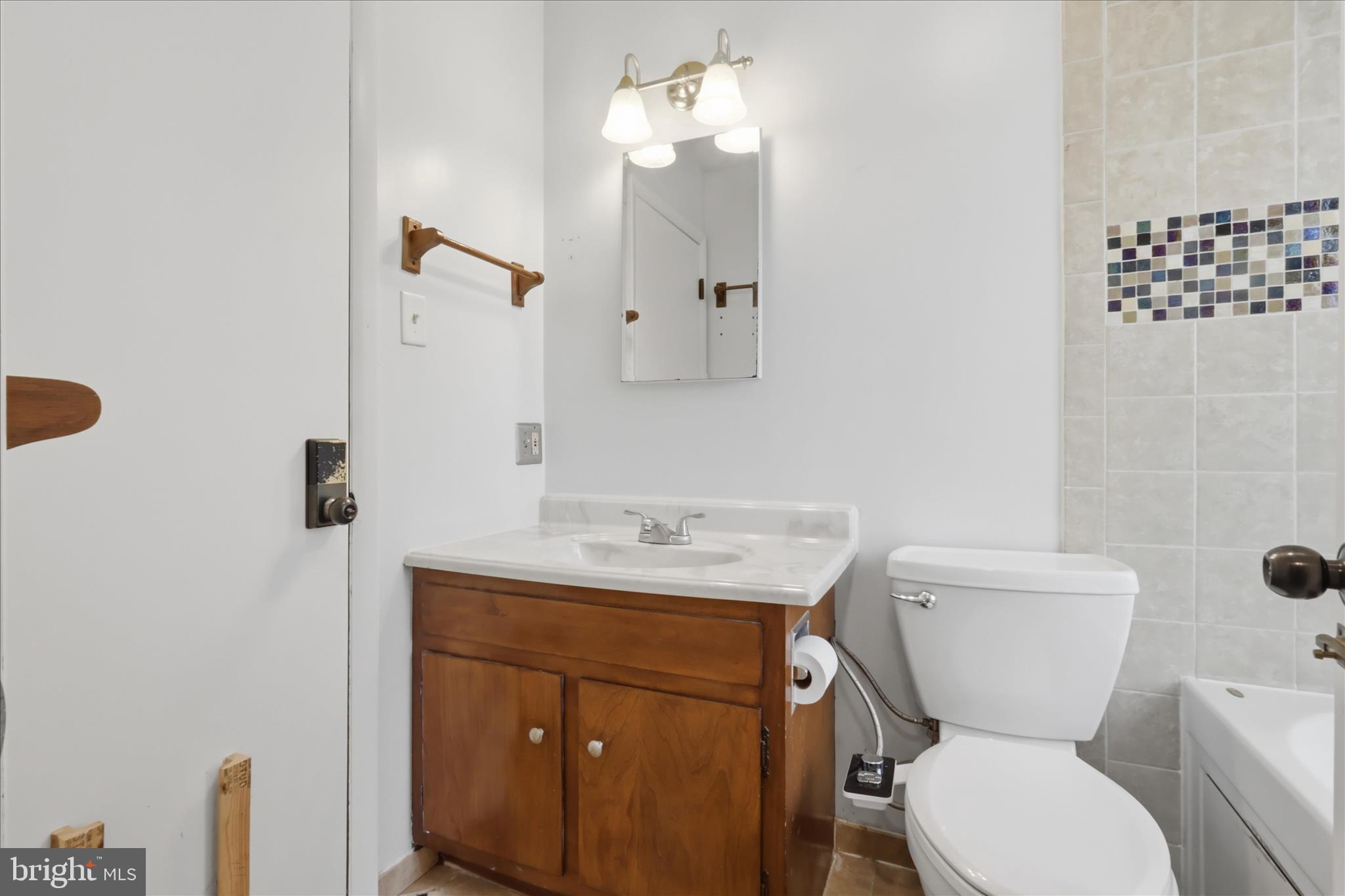 9304 Liberty Court Frederick, MD 21701 - Photo 26 of 49 a bathroom with a toilet a sink and mirror