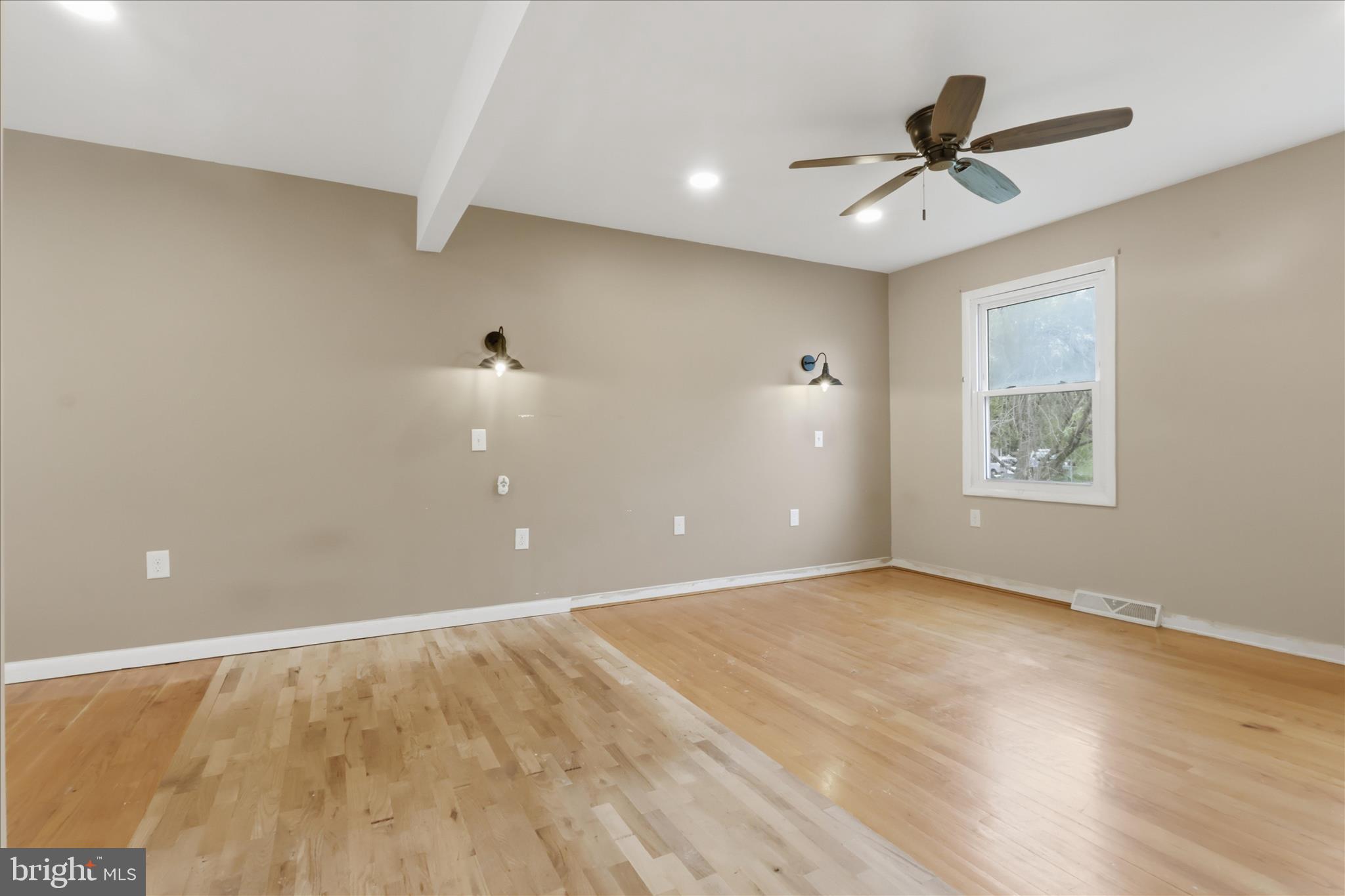 9304 Liberty Court Frederick, MD 21701 - Photo 27 of 49 a view of a big room with wooden floor and windows