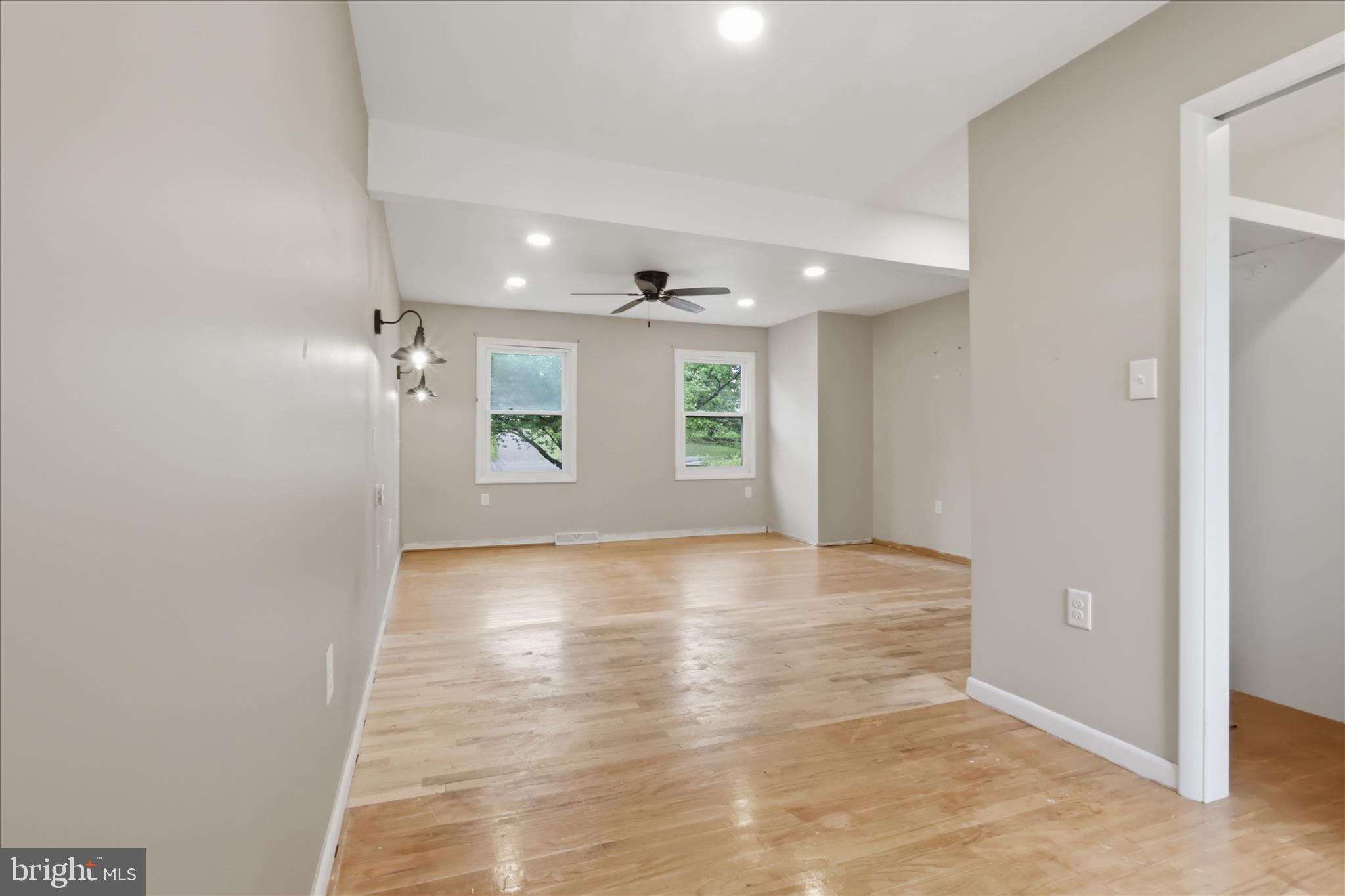 9304 Liberty Court Frederick, MD 21701 - Photo 29 of 49 an empty room with wooden floor and windows