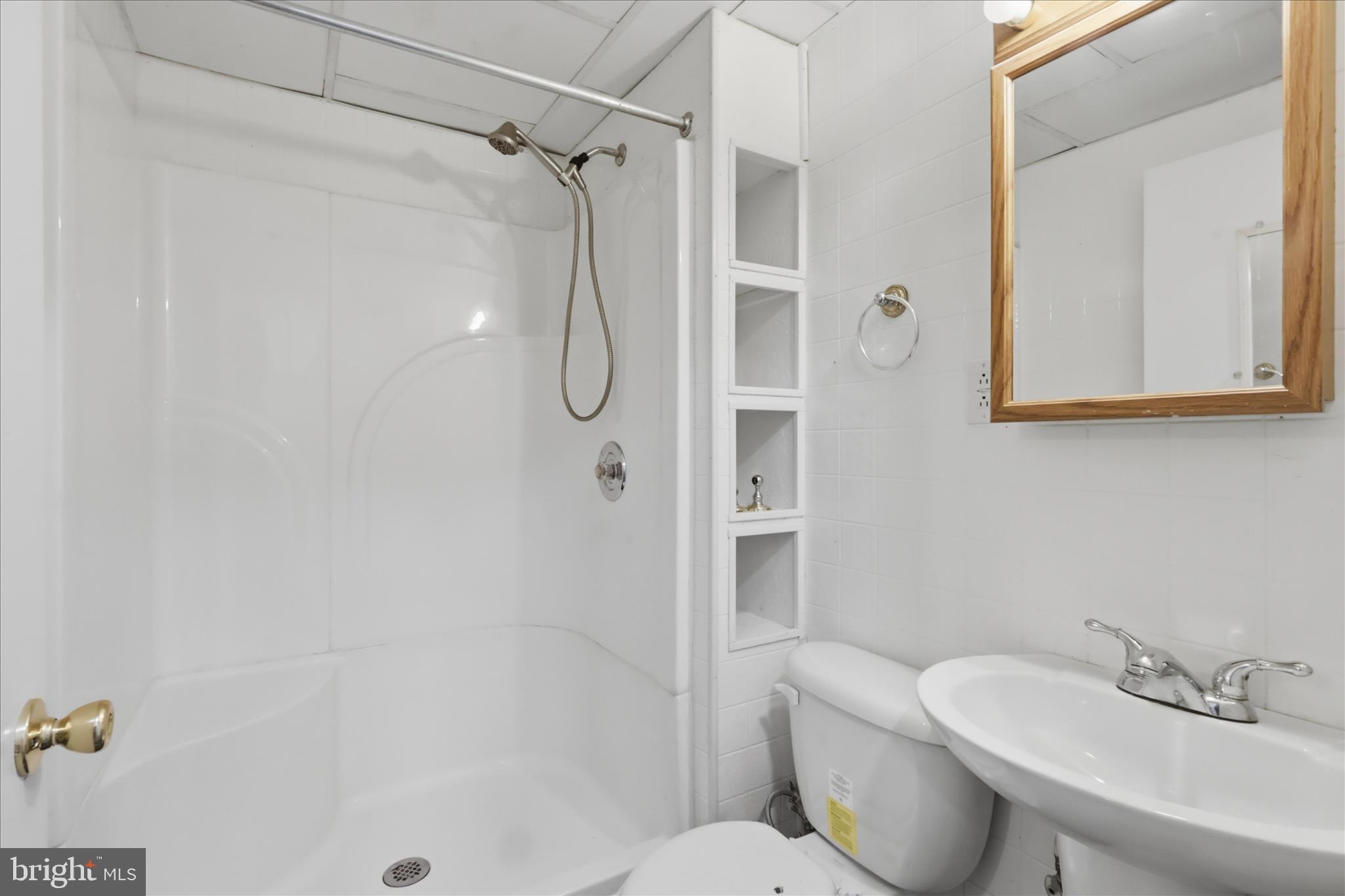9304 Liberty Court Frederick, MD 21701 - Photo 39 of 49 a bathroom with a sink toilet and shower