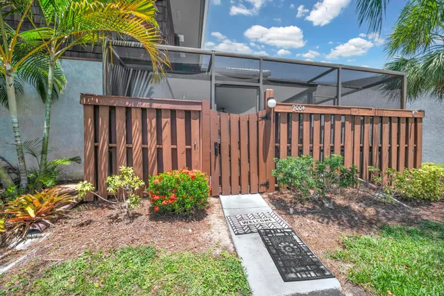 a view of a backyard with potted plants