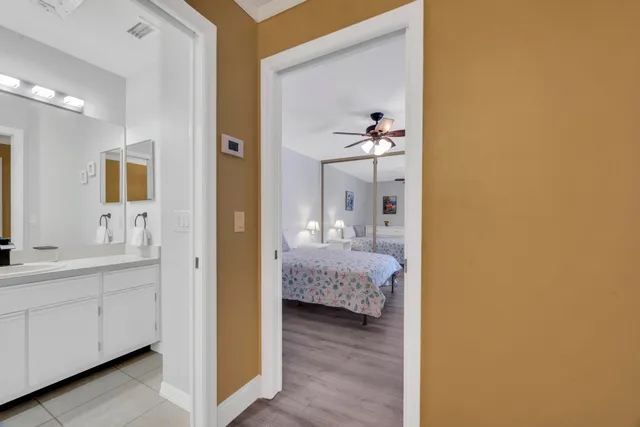 a view of a hallway view with wooden floor and staircase