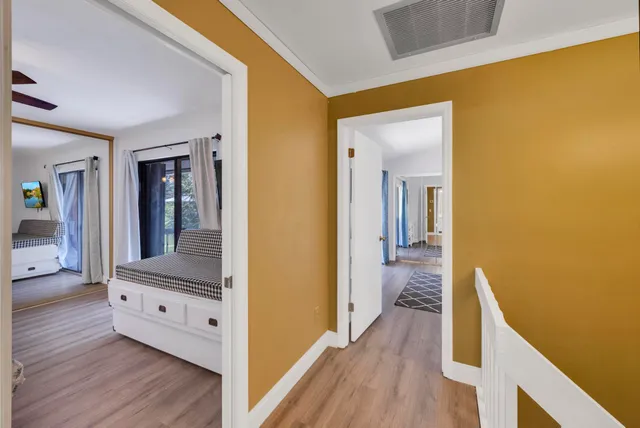 a bed room with a bed and a chandelier