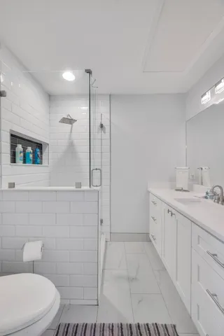 a bathroom with a sink double vanity and a mirror