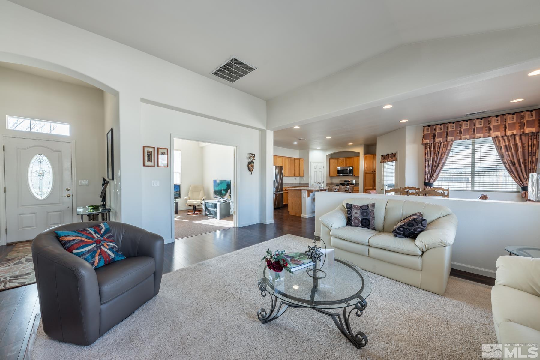 1413 Wild Wolf Way Reno, NV 89521 - Photo 8 of 40 a living room with furniture and wooden floor
