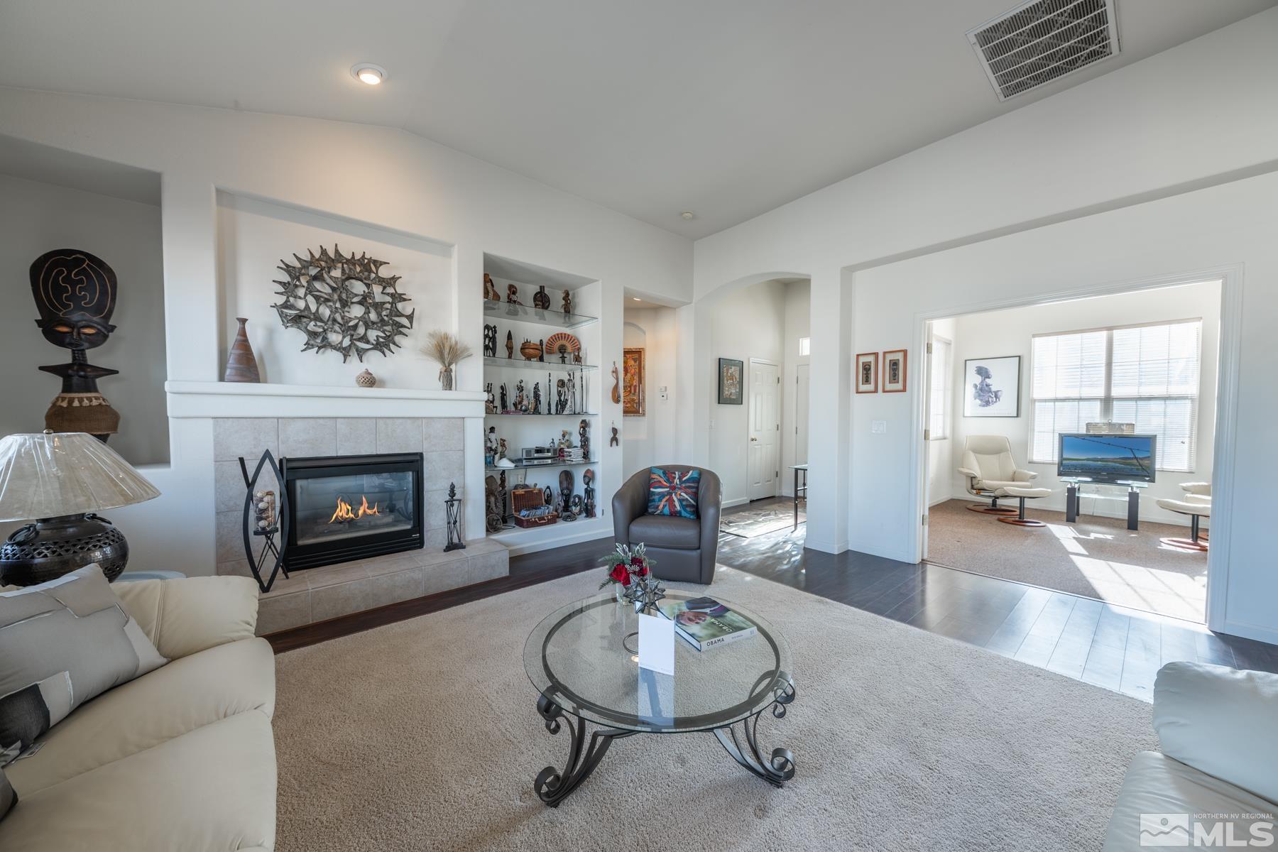 1413 Wild Wolf Way Reno, NV 89521 - Photo 9 of 40 a living room with furniture and a fireplace