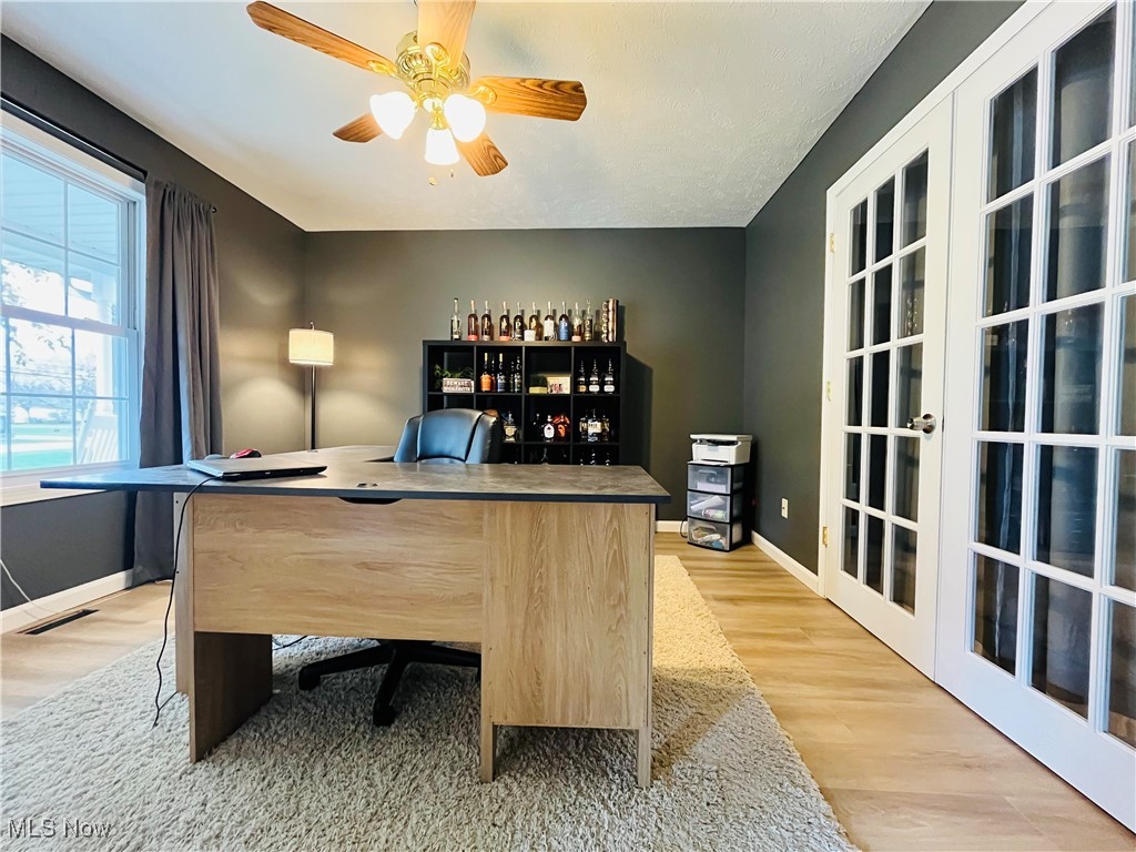 3811 Center Road Perry, OH 44081 - Photo 25 of 50 Office area featuring light wood finished floors, a ceiling fan, and french doors