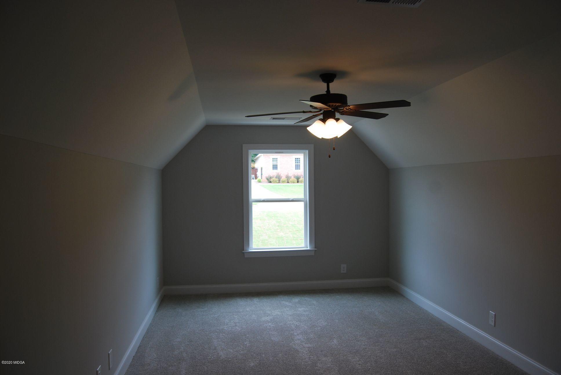 65 Carters Way Forsyth, GA 31029 - Photo 12 of 13 an empty room that has a window