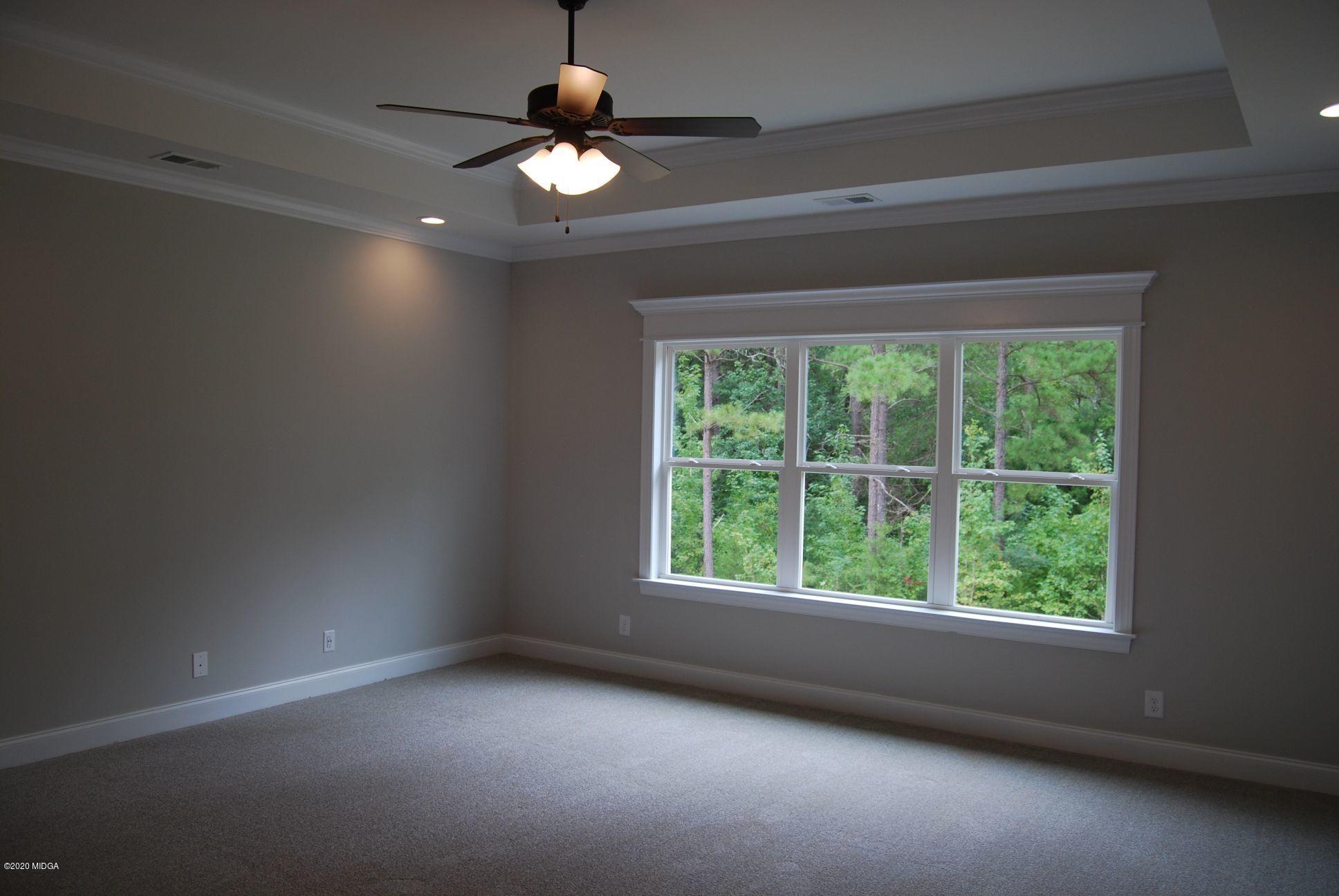 65 Carters Way Forsyth, GA 31029 - Photo 6 of 13 a view of an empty room with a window